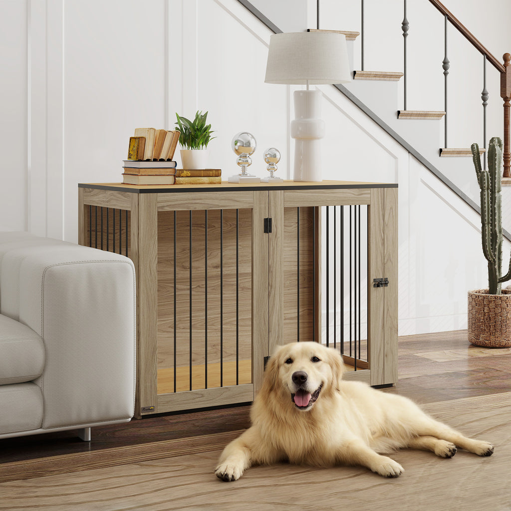 Stilren hundbur i ek som fungerar som sidobord i ett vardagsrum med en hund framför